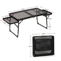 Black Portable Camping Table Heat Resistant Steel Mesh Top Foldable BBQ Desk with Side Wings Adjustable Height Aluminium Frame for Outdoor Picnic.