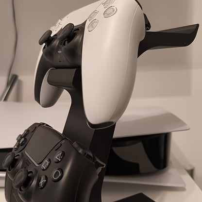 ORANGE 3-in-1 PS5 and Xbox Controller Stand – Compatible with PlayStation 5/Xbox Consoles. A gaming desktop organizer with a headphone hanger, non-charging base that holds 2 controllers and headphones. Space-saving white/black console accessory.