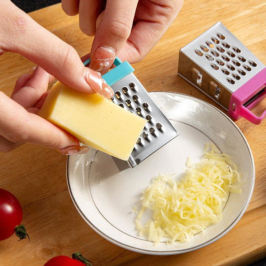 Mini cheese grater - Four-sided grater - Stainless steel slicer - Multifunctional vegetable cutter - Kitchen gadget - Lemon zester - A green.