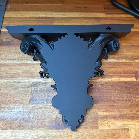3D-printed Gothic wall shelf brackets add a touch of classic Gothic elegance to your interior. Black.