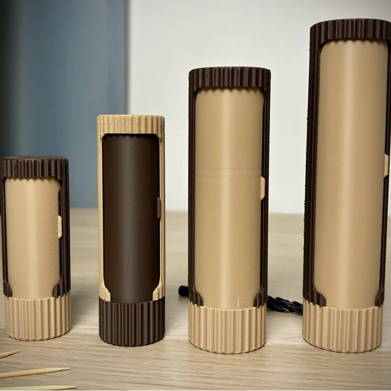 3D-printed compact rotating organizer capsule, 1.3 inches long x 3.4 inches high.