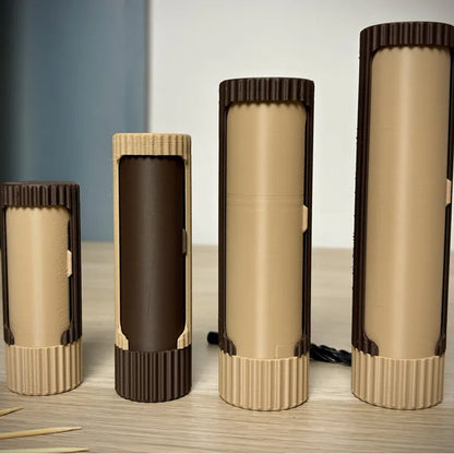 3D-printed compact rotating organizer capsule, 1.3 inches long x 5.9 inches high.