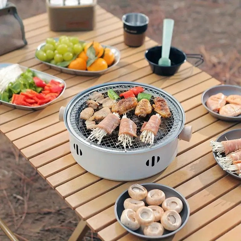 Portable mini tabletop barbecue grill, made of stainless steel, includes a grill mesh, designed for home use, and functions as a detachable charcoal grill.