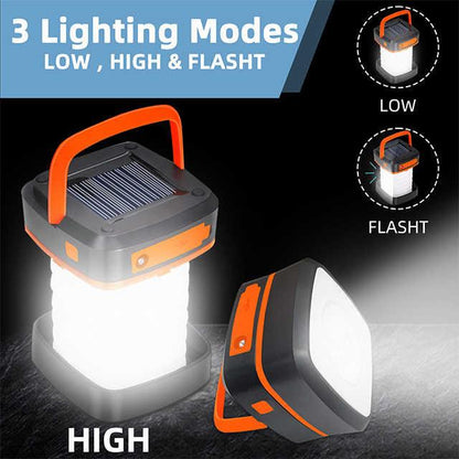 Orange Collapsible Portable Solar LED Camping Lantern with USB Charging.