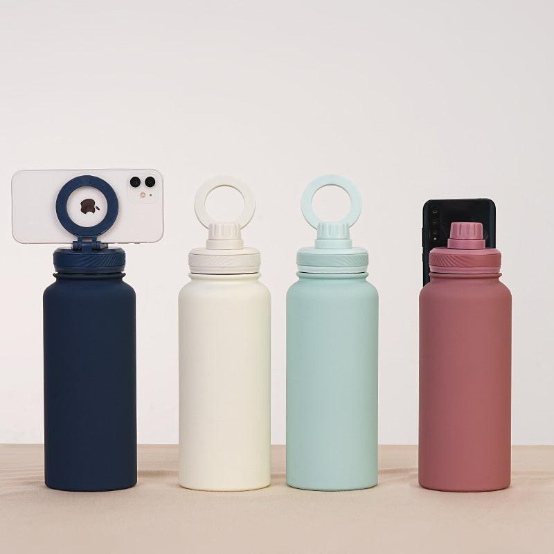 Light Green 1L Stainless Steel Water Bottle with Magnetic Phone Holder Lid - Portable Hydration & Hands-Free Stand.