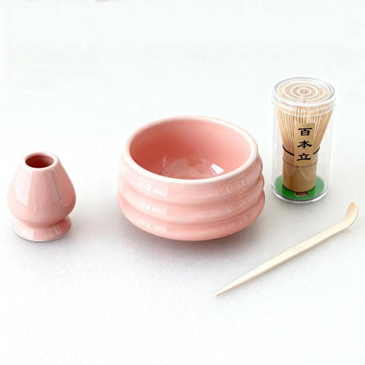 Pink Ceremony 4-Piece Matcha Ceramic Tool Set - Gift Box with Whisk (Chasen), Whisk Holder (Chasen Kuse-Naoshi), Bowl, and Scoop.