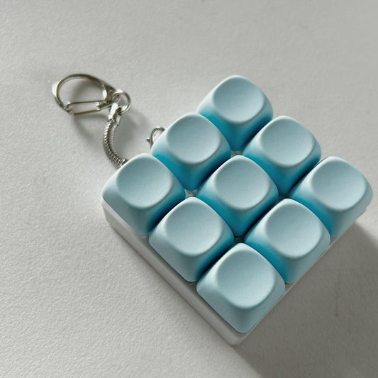2-Pack Light Blue Mechanical 9-Keyboard Fingertip Toy Keychain - Key Pressure Relief, PVC Fingertip Toy.