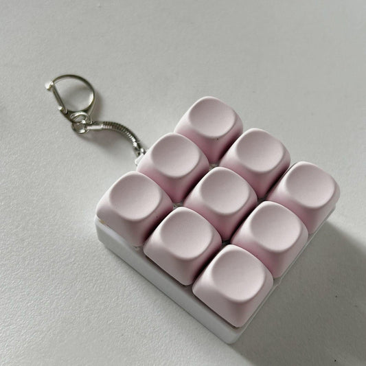 2-Pack Light Pink Mechanical 9-Keyboard Fingertip Toy Keychain - Key Pressure Relief, PVC Fingertip Toy.