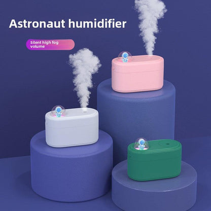 Pink Rechargeable Mini Astronaut Air Humidifier USB Desktop Cool Mist Humidifier with 7-Color LED Night Light for Bedroom and Office.