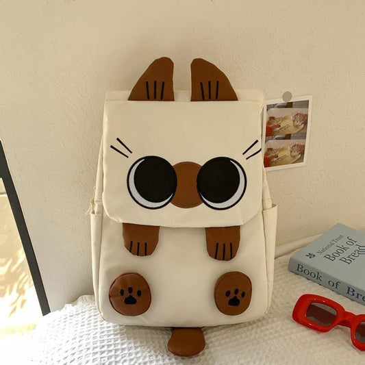 White Lightweight Nylon Waterproof Schoolbag for Children - Large Capacity Daypack with Ugly-Cute Cat Design.