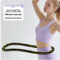 Black Weighted Soft Spring Hula Hoop with Silent Alloy Interior and Polyester Wrap for Home Gym Full Body Fitness and Abdominal Training Solution.