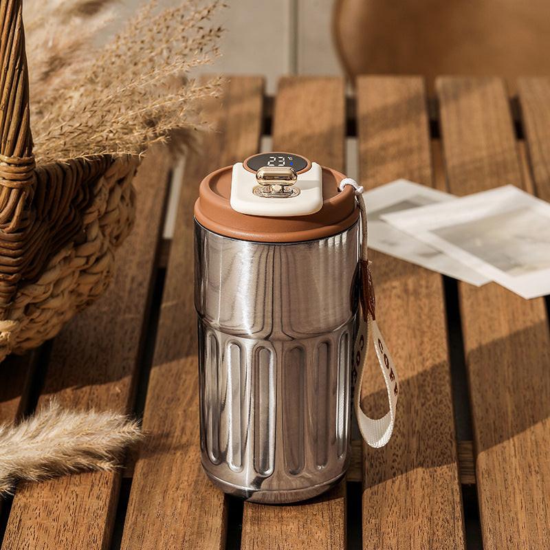 Silver-gray Smart Digital Insulated Coffee Mug with 316 Stainless Steel Inner Liner â Vacuum-Sealed Travel Tumbler with Temperature Display, USB-C Rechargeable, Leak-Proof Lid for Hot and Cold Beverages.