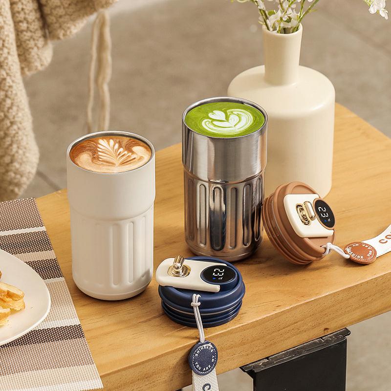 Silver-gray Smart Digital Insulated Coffee Mug with 316 Stainless Steel Inner Liner â Vacuum-Sealed Travel Tumbler with Temperature Display, USB-C Rechargeable, Leak-Proof Lid for Hot and Cold Beverages.