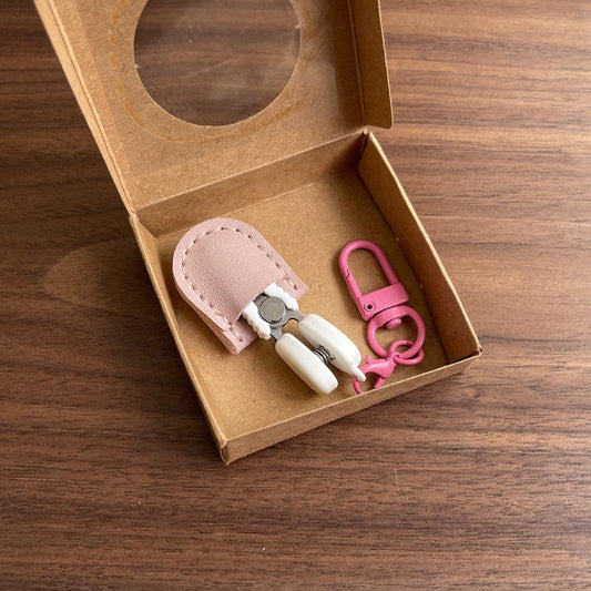 Pink Ultra-Portable Mini Precision Scissors Set - Compact 7cm Craft Snips with Safety Cap, Leather Sheath, and Keychain Hook for Travel and DIY.