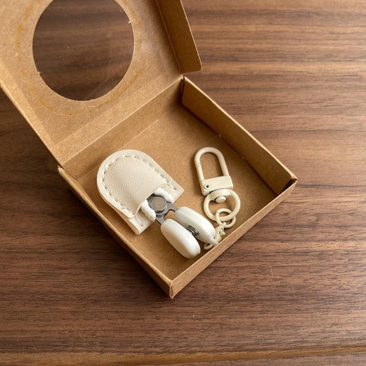 White Ultra-Portable Mini Precision Scissors Set - Compact 7cm Craft Snips with Safety Cap, Leather Sheath, and Keychain Hook for Travel and DIY.